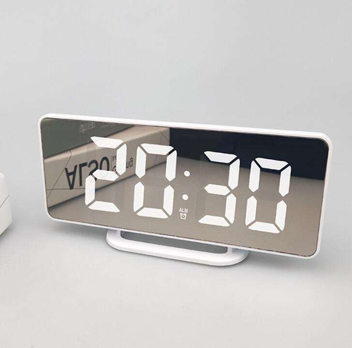 Dual USB charging alarm clock with snooze button and modern design